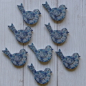 Pack of 8 blue floral bird shape embellishments with self adhesive pad