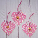 Set of 3 pink heart hanging decorations with floral design & bell