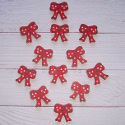 Pack of 12 wooden Bows painted red, as shown with self adhesive pad