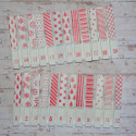 Set of 24 numbered Advent pegs with red & white patterns, as shown